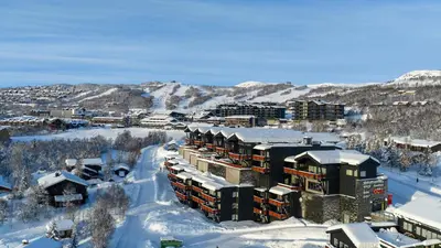 an aerial view of a resort in the snow at Stor Toppleilighet I Sentrum in Beitostøl