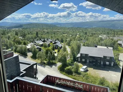 a view from the balcony of a house at Stor Toppleilighet I Sentrum in Beitostøl