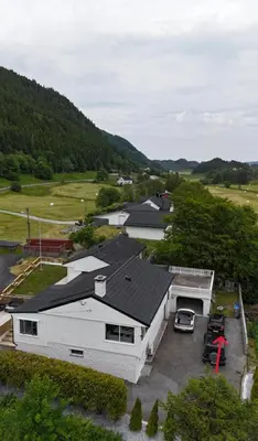 an aerial view of a white house with a parking lot at Apartment in Bergen in Bergen