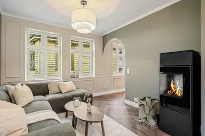 a living room with a couch and a fireplace at The Townhouse Dream I No Expense Spared I NEW 2025 in Bergen