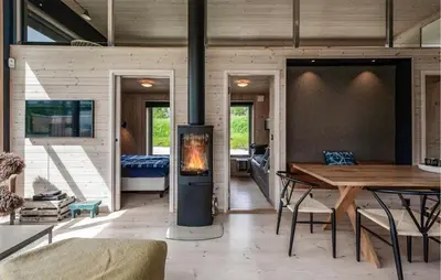 a living room with a fireplace in a house at Lovely Home In Ål With House Sea View in Ål