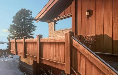 a wooden house with a fence and a window at Amazing Home In Tunhovd With Sauna in Tunhovd