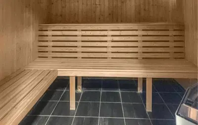 a sauna with a wooden bench in a room at Amazing Apartment In Bjorli With Sauna in Bjorli