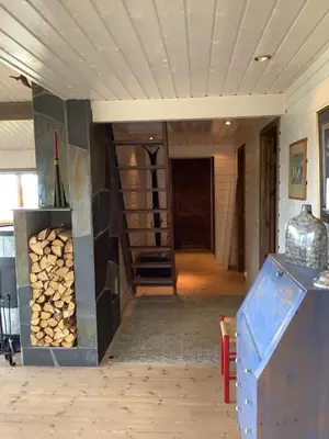 a room with a rack of fire wood at Skarvegløtt Ski in Ski out in Nesbyen