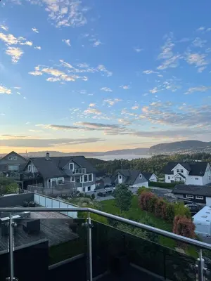 a view from the balcony of a house at Semi-detached house with lovely views of the city fjord in Askøy