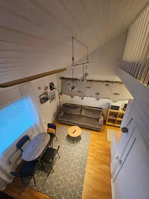 an overhead view of a living room with a table and chairs at Atlanten Turistsenter in Kristiansund