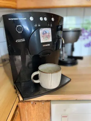 a coffee maker sitting on a counter with a coffee cup at Studio in Os Near Bergen