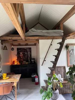a room with a loft with a bed on the ceiling at Gjestehus i Hurdal uten innlagt vann Delt bad in Hurdal