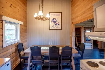 a dining room with a table and chairs at Trysilfjellet Sør 480 in Trysil