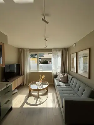 a living room with a couch and a table at Leilighet i Bergen sentrum in Bergen
