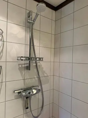 a shower in a bathroom with a shower head at Norefjell Ski in - Ski out in Noresund