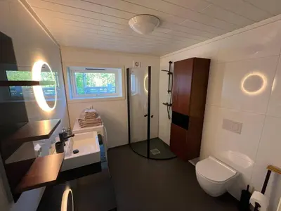 a bathroom with a toilet and a sink at The simple appartment in Stryn in Stryn