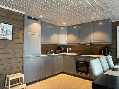 a kitchen with gray cabinets and a counter top at Annebu by Norgesbooking - cabin at 1000 meter with amazing view in Ål