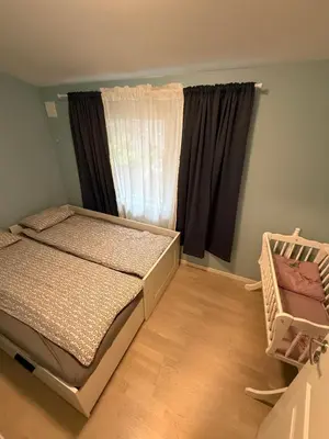 a bedroom with a bed and a window at Home with 5 bedrooms, great view and garden in Bergen