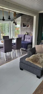 a living room with a couch and a table at Cottage in Hellesøy, Øygarden in Hellesøy