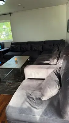 a living room with two beds and a couch at Helt hus leies ut under fiskeri messe 2025 in Trondheim