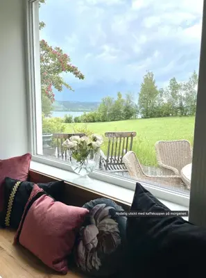 a window with a view of a table and chairs at Villa Solås in Lillehammer