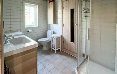 a bathroom with a toilet and a sink and a shower at Gorgeous Home In Rauland With Sauna in Rauland