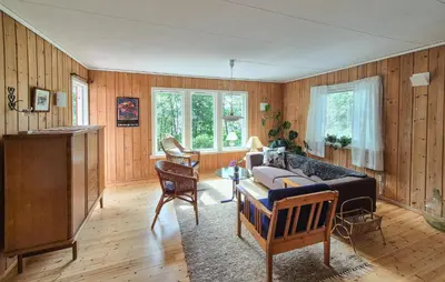 a living room with a couch and a table at Lovely Home In Masfjordnes With Wifi in Masfjorden