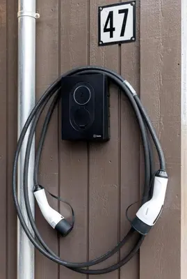 a pair of headphones hooked up to a wall at Modern apartment, large terrace free parking and Wallbox in Ytterland