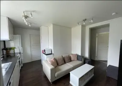 a living room with a couch and a table at Alfred Apartment in Trondheim in Trondheim