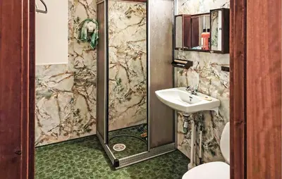 a bathroom with a shower and a sink at Stunning Home In Engerdal With Wifi in Nymoen