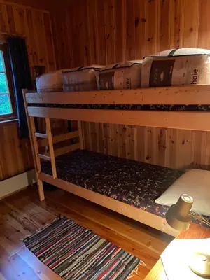 a couple of bunk beds in a room at Det er en fantastisk og romslig hytte i Slemdalen, Nordre Osen! in Åmot