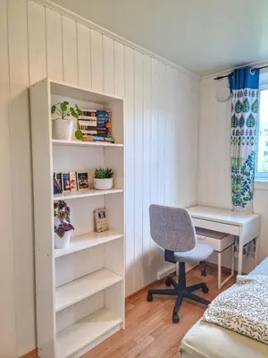 a bedroom with a desk and a chair and a computer at Private Room in a shared Apartment with Mountain Views & Greenery in Trondheim