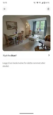 a living room with a couch and a table at Trondheim Center in Trondheim