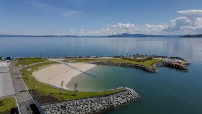 an aerial view of a golf course on the water at Nice apartment with sea view in Trondheim