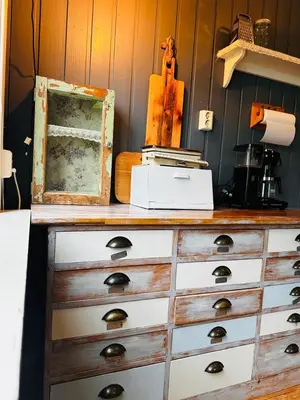 a wooden dresser with a box on top of it at Charming family house near Kvitfjell in Ringebu