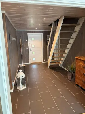 a hallway with a staircase in a house at New cottage near the city center and ski slope in Hemsedal