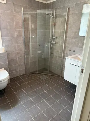 a bathroom with a shower and a toilet at New cottage near the city center and ski slope in Hemsedal