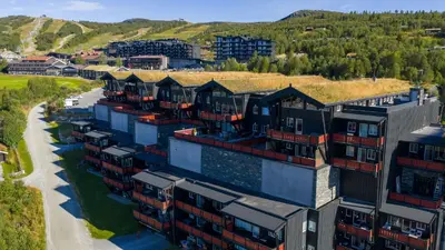 an aerial view of a building with a grass roof at Family Friends, 3 Bedroom Apartment With Terrace in Beitostøl