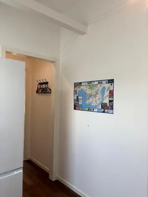 a map hanging on a wall in a room at In the middle of Bergen City in a real Bergenshus from the 18th Century in Bergen