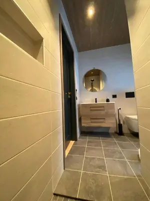 a bathroom with a sink and a mirror at 2 Cabins surrounded by beautiful nature in Stryn