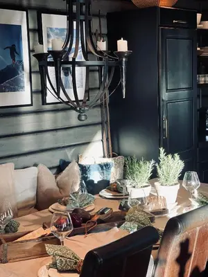 a dining room with a table with a couch at No71 Golsfjellet in Golsfjellet