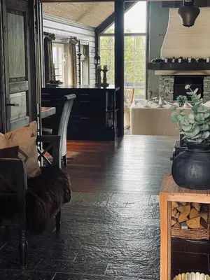 a living room with a wooden floor and a table at No71 Golsfjellet in Golsfjellet