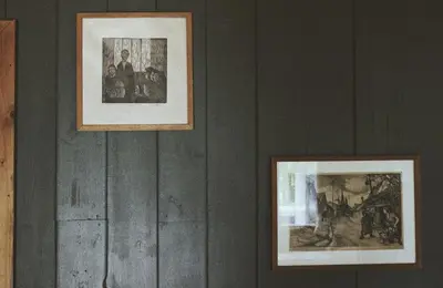 two framed photographs hanging on a wall at Waterfall Retreat in Sel