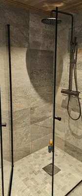 a shower with a glass door in a bathroom at New Cabin With Panoramic Views Of Lake Osen