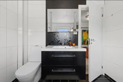 a bathroom with a toilet and a sink at Idyllic house in Hurdal 2 bedroom in Hurdal