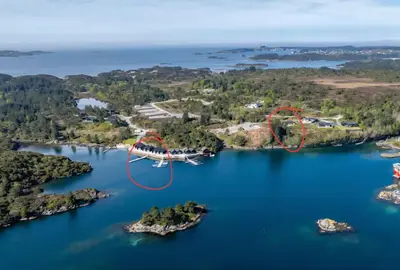an aerial view of a group of islands in a lake at Ny feriehytte i skjærgården in Austevoll
