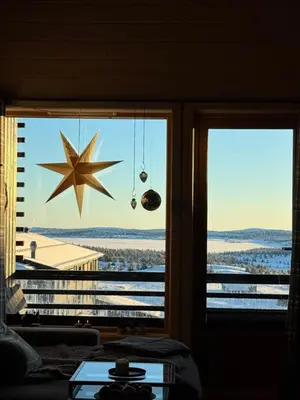 a window with a star hanging in a room at Pellestova - Hafjell in Øyer