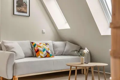 a living room with a couch and a table at 307SB10 - Three Bedroom Stay in Bergen