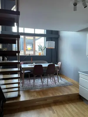 a dining room with a table and two chairs at Modern apartment in the middle of Bergen city center in Bergen
