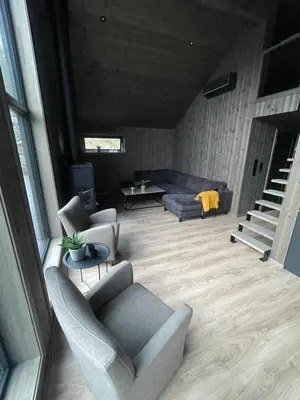 a living room with two chairs and a couch at Flott hytte i Sogndal skisenter-Hodlekve in Sogndal