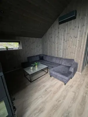 a living room with a couch and a table at Flott hytte i Sogndal skisenter-Hodlekve in Sogndal