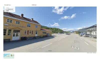 a picture of a street with a yellow building at Sentrumsvegen 28, GOL in Gol