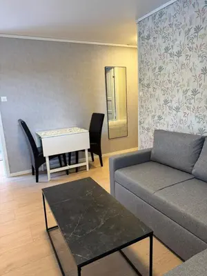 a living room with a couch and a table at Bergtun's Corner - Sotra Vest in Sekkingstad