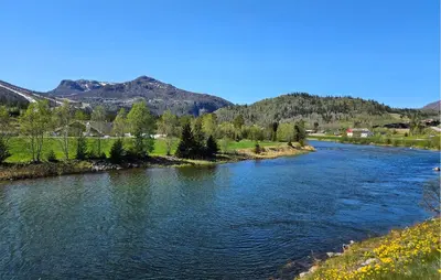 a river with trees and mountains in the background at 3 Bedroom Awesome Apartment In Hemsedal in Hemsedal